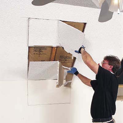 Mark the skylight opening and cut out rough opening with a drywall saw
