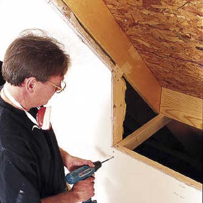 Drive nails through the plywood roof sheathing in each of the four corners of the rough opening