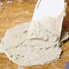 applying poultice to a countertop for stain removal
