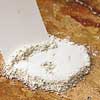 scraping off the dry poultice witha  putty knife