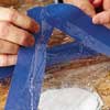 covering the wet poultice with plastic wrap