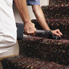 Attaching a stair runner to treads