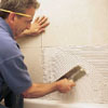 Trowel on the tile mastic