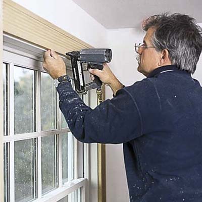 Tom Silva trimming out a window