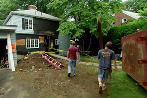 Kevin O'Connor approaches the Auburndale house at the beginning of renovation