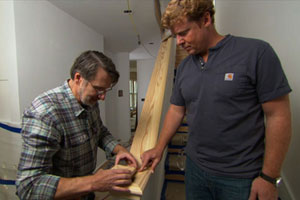 Norm Abram creates a custom newel cap as Kevin O'Connor looks on