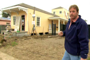Roger Cook in front of the New Orleans house project