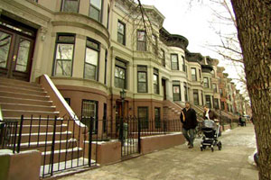 homeowners walking up to the New York City house project