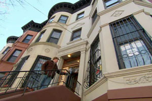 Kevin O'Connor at the door of the New York City house project
