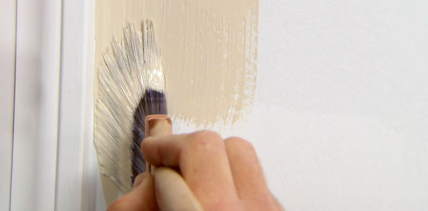 demonstrating how to paint edges with a brush