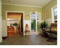 Serving many purposes, this mudroom is both an in-between area joining outdoors and indoors and a hub tying together the living room, powder room, stairs, front entry and porch.