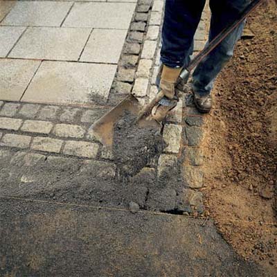 filling the joints with polymeric sand