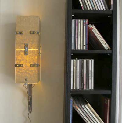 Plexiglas sconce in studio apartment