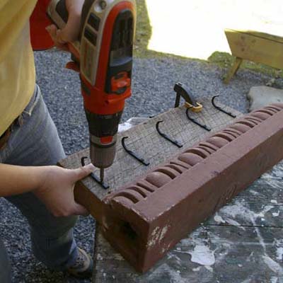 positioning hooks for cornice turned into garden tool holder