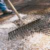Raking the soil.
