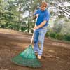 Raking the grass seed.